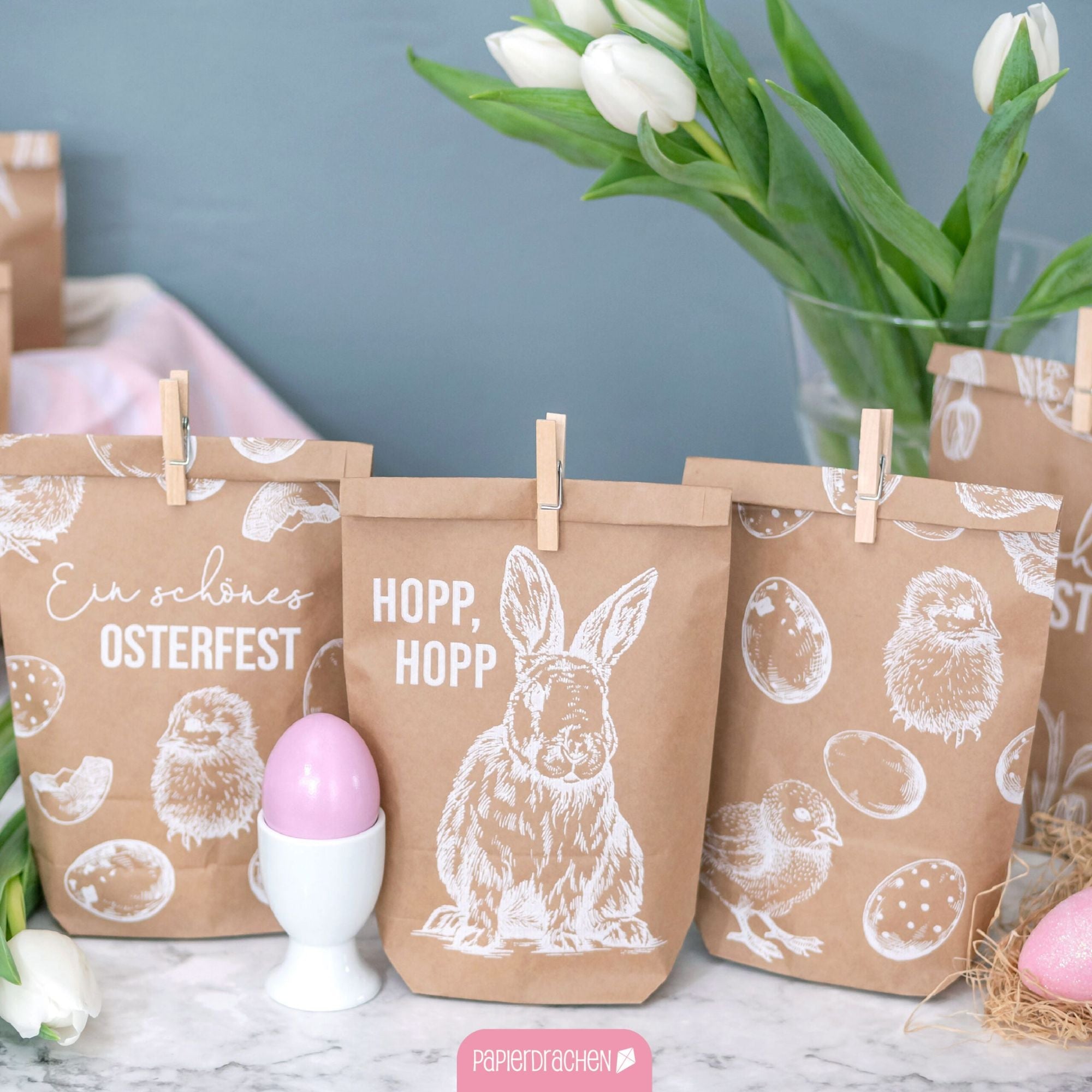 12 weiß bedruckte Geschenktüten Ostern Papierdrachen - malmichmunt.com